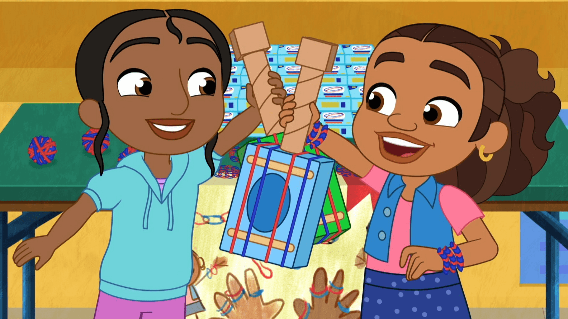 Alma and Rafia try to give away rubber bands./Alma and Rafia help with a bake sale.