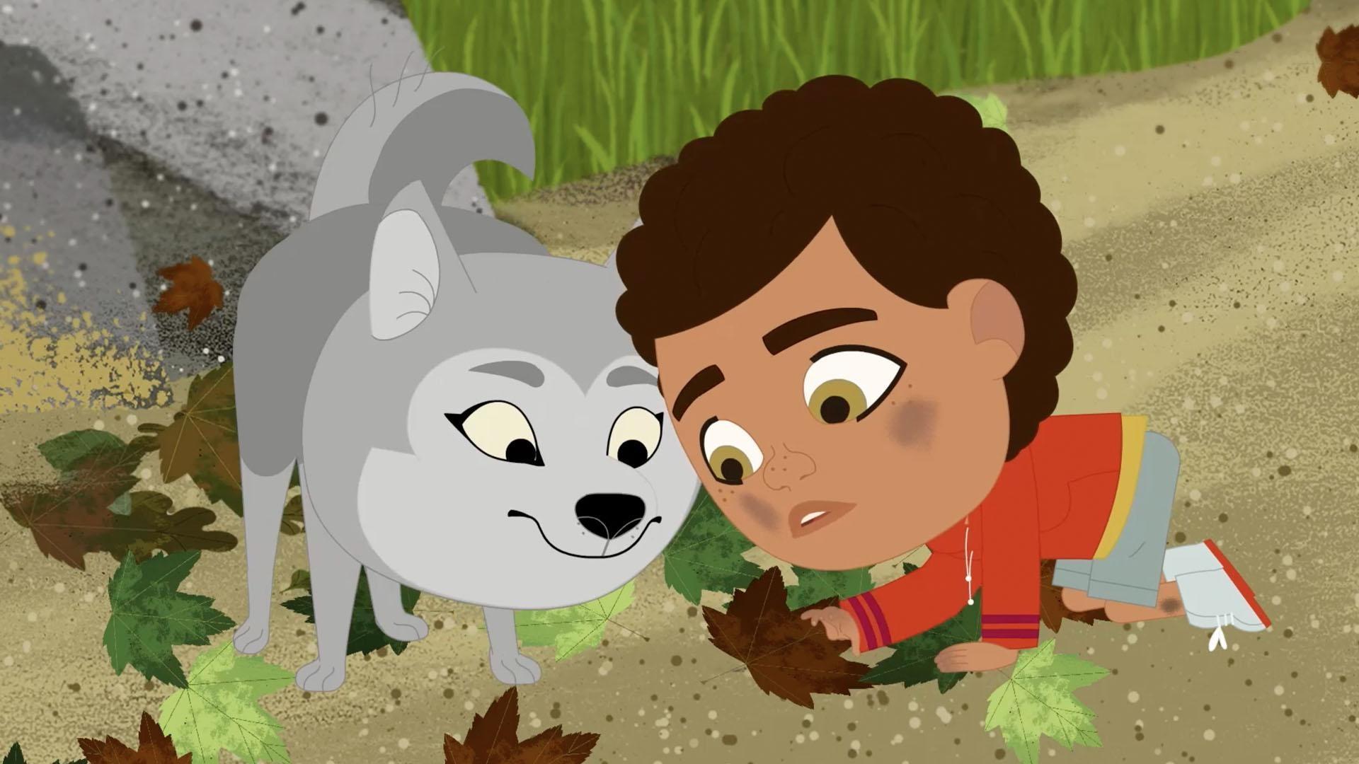 Looking at the ground near a rock, Rider and Wolfie find a family of roly poly bugs.