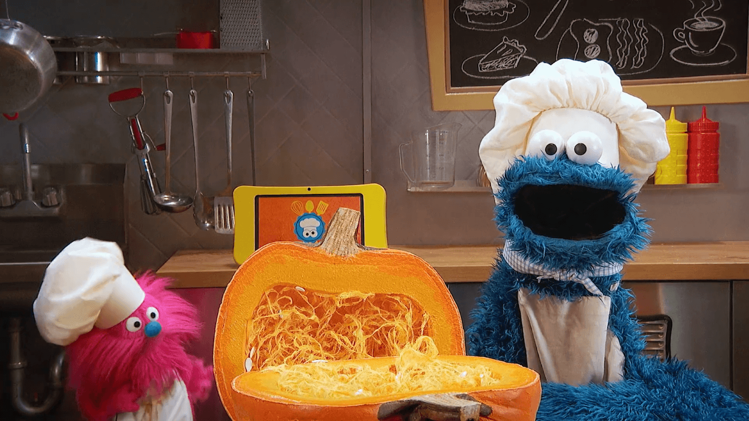 Cookie Monster and Gonger learn how to make pumpkin soup.